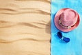 Top view of sandy beach with towel frame and summer accessories. Background with copy space and visible sand texture. Royalty Free Stock Photo