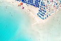 Top view of sandy beach with turquoise sea water and colorful umbrellas Royalty Free Stock Photo