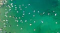 Top view of sandy beach with turquoise sea water and local boats Royalty Free Stock Photo