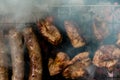 Top view of sausage and meat grilling on barbecue Royalty Free Stock Photo