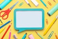 Top view of school supplies and speech bubble with space for text. Back to school concept Royalty Free Stock Photo