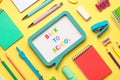 Top view of school supplies and speech bubble with the text Back to school. Back to school concept Royalty Free Stock Photo