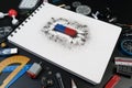 Top view of science school accessories desk with science laboratory, blank paper and bar magnet magnetic field on black background