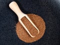 Top view of scoop on wholegrain teff seed on black Royalty Free Stock Photo