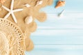Top view of sea straw hat and sea shells on the sea sand on a blue wooden background, Summer concept on empty blue wood floor and Royalty Free Stock Photo