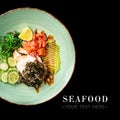 Top view of Seafood Asian Poke bowl isolated on black background ready food banner with text space