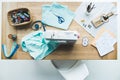 top view of seamstress workplace with fabric, sewing machine, drafts Royalty Free Stock Photo