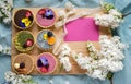 Top view of selection of colorful and delicious cake desserts in box on table. Copy space.