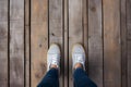 Top view selfie, feet and shoes on a wooden floor