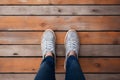 Top view selfie, feet and shoes on a wooden floor