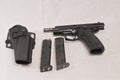 Top view of a semi automatic hand gun, with the slide locked in the open position and two magazines Royalty Free Stock Photo