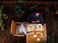 Top view of senior couple in wheelchair having dinner in the evening on terrace. Royalty Free Stock Photo