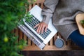 Top view of senior woman with laptop sitting outdoors on terrace, working. Royalty Free Stock Photo