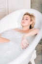 Blonde woman relaxing in bath Royalty Free Stock Photo