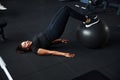 Cheerful young woman exercising buttocks in gym Royalty Free Stock Photo