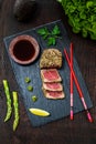 Top view of sesame seared yellowfin tuna on black slate Royalty Free Stock Photo