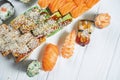 Top view on set of assorted roll and sushi on green plate isolated on white wooden background. Sushi with salmon, eel. japanese Royalty Free Stock Photo