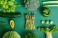 Top view set of healthy raw vegetables on the green background with. Vegetarian and vegan diet diet eating and cooking. Veganism Royalty Free Stock Photo