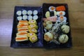 Top view Set Japanese food Sushi on rice Eggs Shrimp Takoyaki Eggs Delicious freshness on a plate on a wooden table