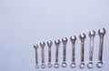 top view of set of spanners and wrench on blue grey background. Repairing tools Royalty Free Stock Photo