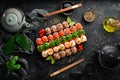 Top view. set of sushi rolls on a black stone plate. Traditional Japanese food. Royalty Free Stock Photo