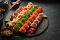 Top view. set of sushi rolls on a black stone plate. Traditional Japanese food. Royalty Free Stock Photo