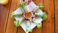 Top view, Setting vegetable around spring roll plate. food concept footage. Royalty Free Stock Photo