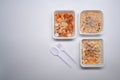 Several frozen meal on white background with copy space for text.