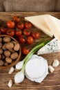 Top view on several kinds of cheese and vegetable Royalty Free Stock Photo