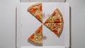 TOP VIEW: Several pieces of Pizza in The Box