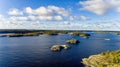 Top view of several small stone islands located in the middle of the water of Lake Ladoga Royalty Free Stock Photo