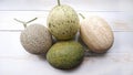 top view of several types of melons on a white wooden table Royalty Free Stock Photo
