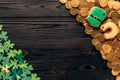 top view of shamrock and golden coins on wooden table, st patricks Royalty Free Stock Photo