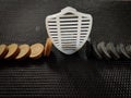 Top view Of Shield Security Icon Stopping one black and white coin from falling.