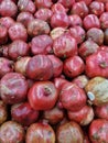 Top view of shiny deep pink fresh organic pomegranates