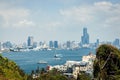 Top view of ships on voyage at Kaohsiung harbor against a cityscape from Cijin in Taiwan