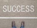 Top View of Shoes on the floor with the text: Your Success Starts Here Royalty Free Stock Photo