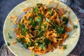Top view shoot of fresh looking carrot salad on plate
