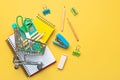 Top view of shopping cart and school supplies with space for text. Back to school concept Royalty Free Stock Photo