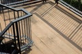 Top view shot of beautiful stairway down from high level to the ground of modern style building with sunlight in evening and Royalty Free Stock Photo