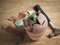 A broken Money box with a hammer and Saudi Riyal banknotes and coins 1