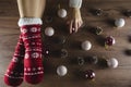 Top view shot of crossed feet in red Christmas socks