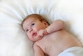 Top View Shot Of Cute Little Baby boy. Curious Newborn baby looking up.