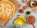 Top view shot of delicious tasty juicy of Hawaiian traditional Italian crust thin crispy ham and pineapple pizza placed on wooden