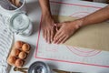 Top view shot of hands of Hispanic baker making cinnamon rolls