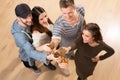 Top view shot of happy friends with alcohol cocktails Royalty Free Stock Photo