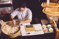 Top view shot. hardworking chef taking rice to prepare roll