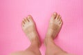 Top view shot of male feet on wooden background. Flat feet.