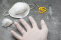 Top view shot of medical mask, cotton wool, scissors, syringe, and a surgeon hand Royalty Free Stock Photo