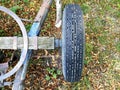 Top view shot of an old tractor-trailer wheel junked in a barn